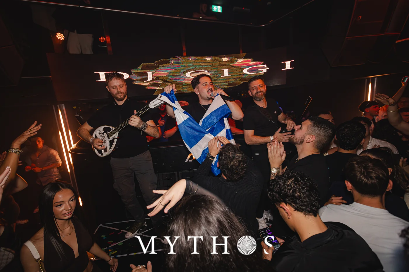 Greek flag and live performers at MYTHOS, AURA, 22 August 2025